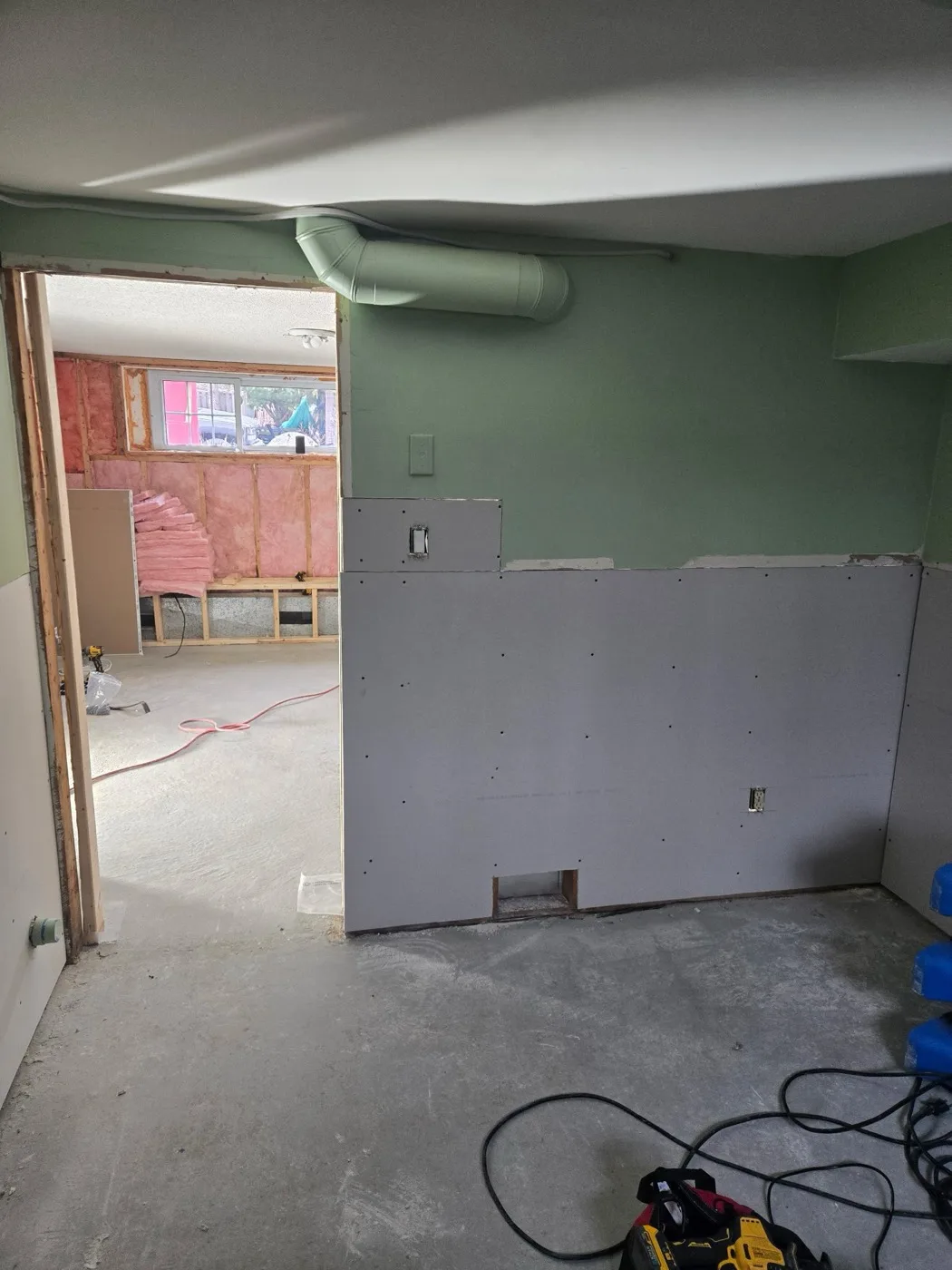 Basement renovation with new drywall and ductwork by Near North Construction and Stucco