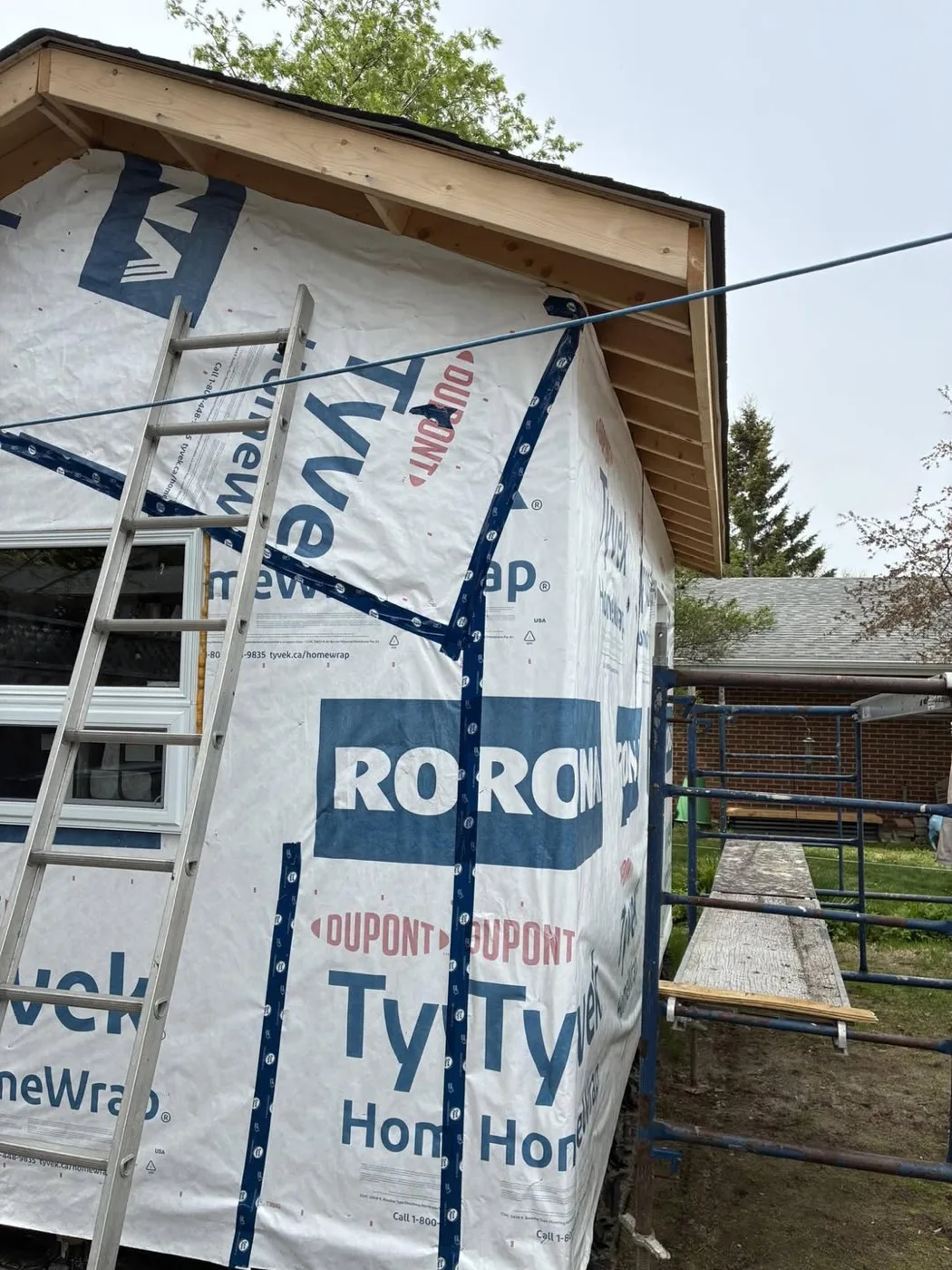 Exterior house wrap and scaffolding prepared by Near North Construction and Stucco before EIFS installation