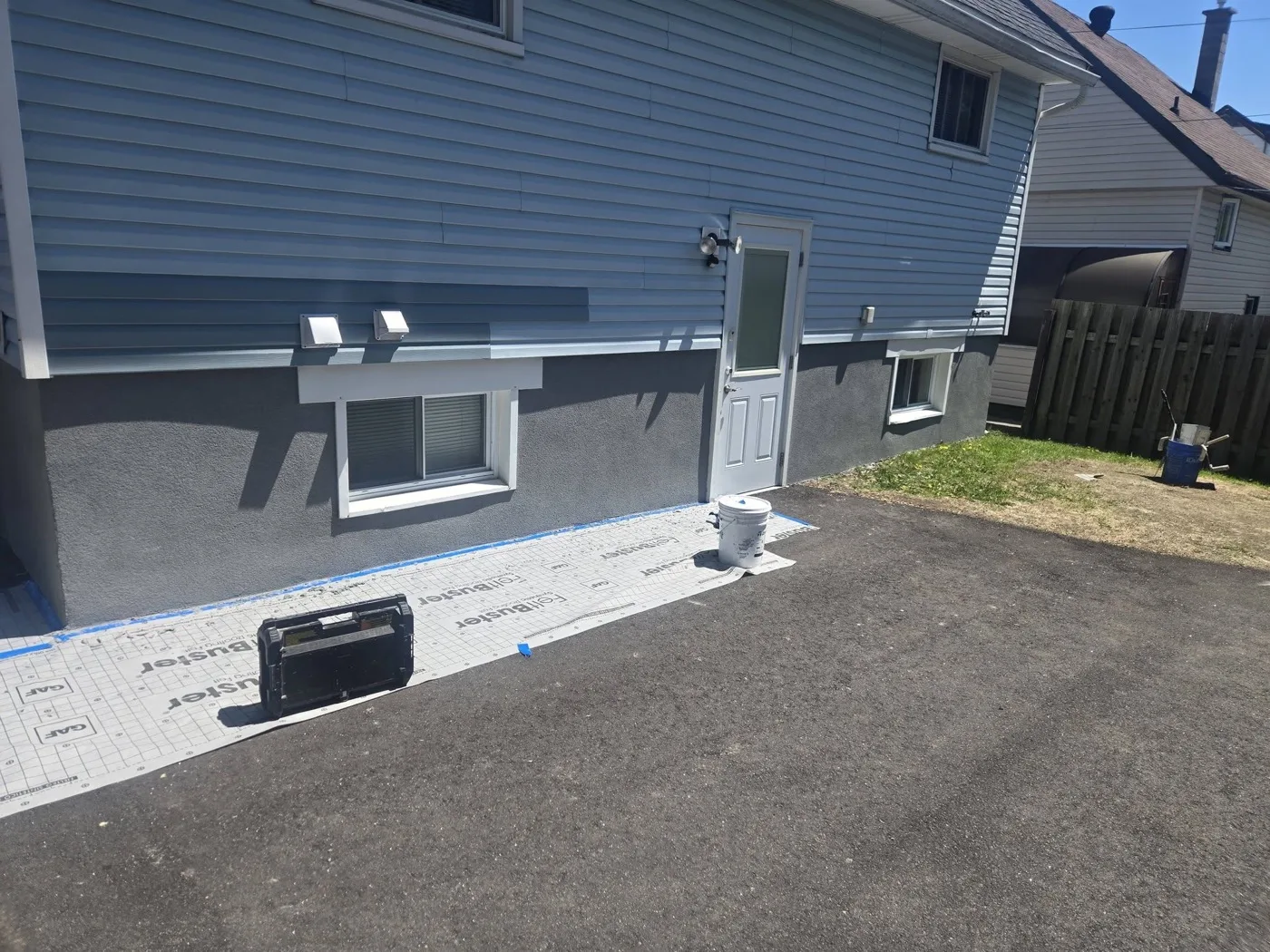 Completed stucco and parged foundation exterior on a North Bay home by Near North Construction and Stucco
